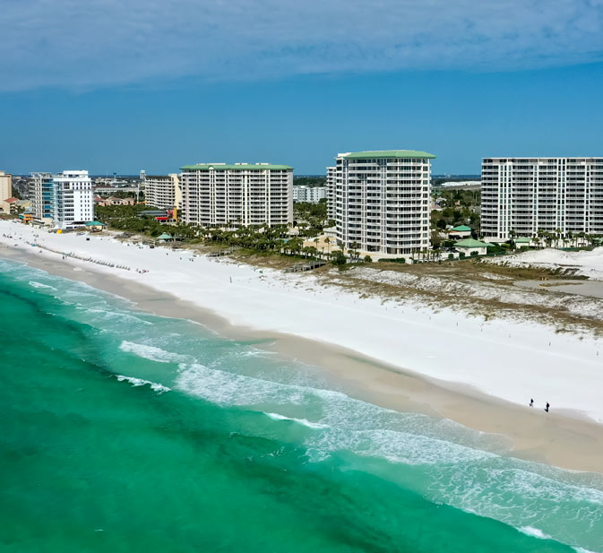 Condominium communities beachfront Ariel photo.